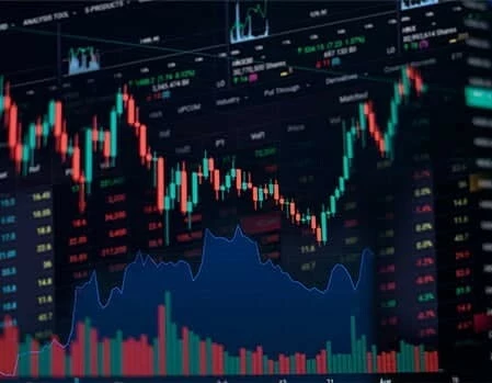 A team of business people collaborates in a meeting room, analyzing graphs on a large screen for an AI trading platform.